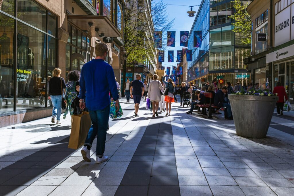 Shopping street with people walking and shopping